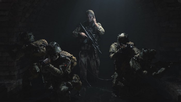 Soldiers in a dark environment, one on the phone