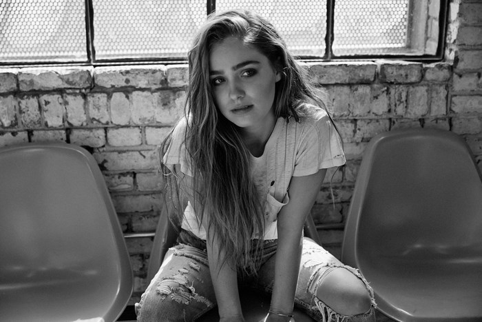 Haley Lu Richardson sitting in chairs