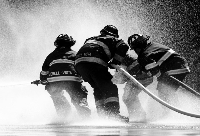 Firefighters spraying water