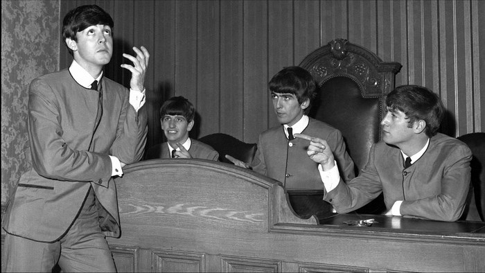 The Beatles in a courtroom setting