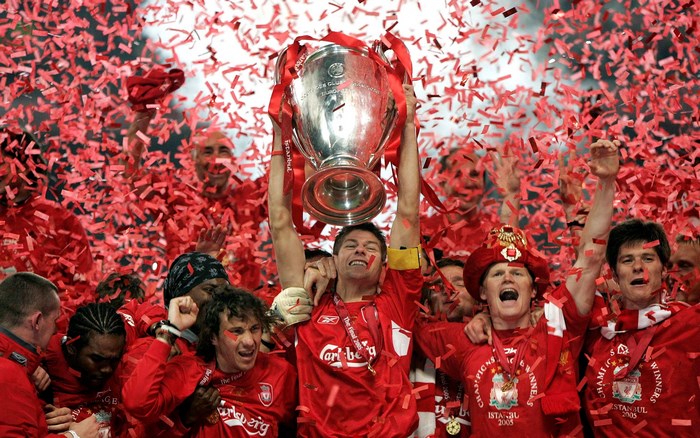 Liverpool FC players celebrating with Champions League trophy