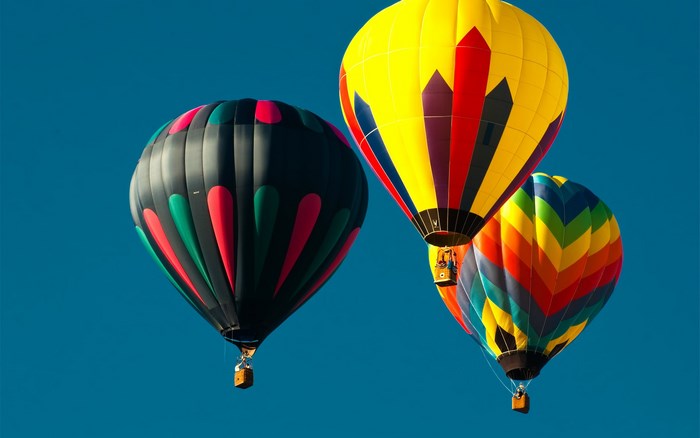 Three hot air balloons in the sky