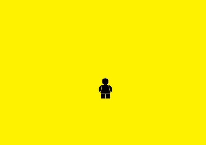 Black Lego minifigure on yellow background
