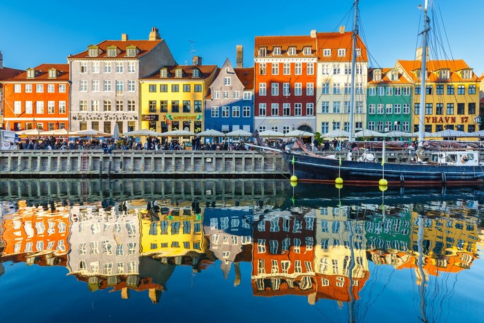 Nyhavn canal in Copenhagen with colorful buildings and boats