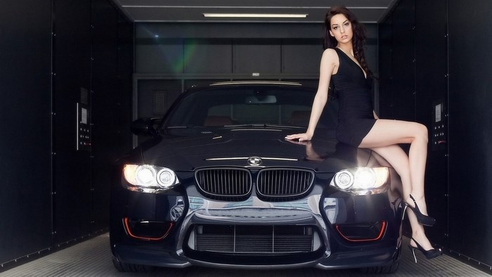Elegant Woman Posing on Black BMW Car