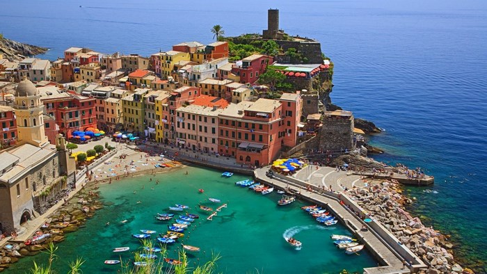 Vernazza, Italy: Colorful buildings on a cliff overlooking the sea