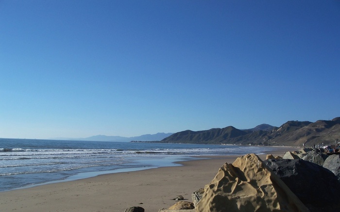 Beach with Mountains and Ocean