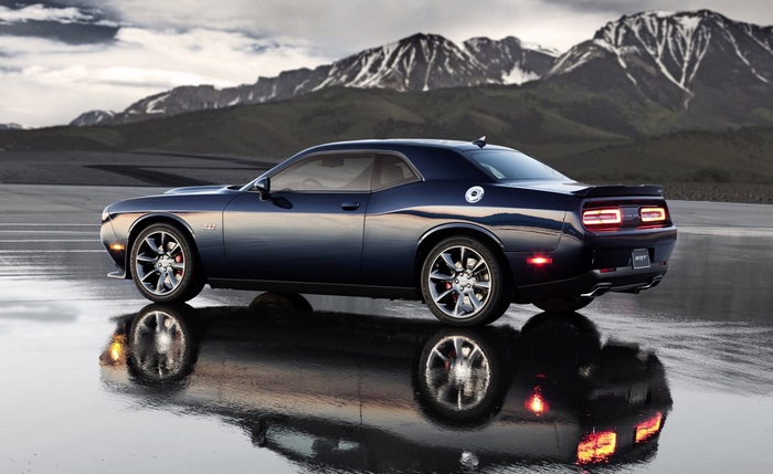 Dark blue Dodge Challenger SRT Hellcat on wet road