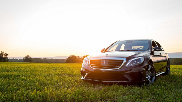 Mercedes S-Class AMG in a field at sunset