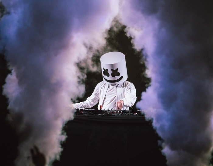 Marshmello DJing surrounded by smoke