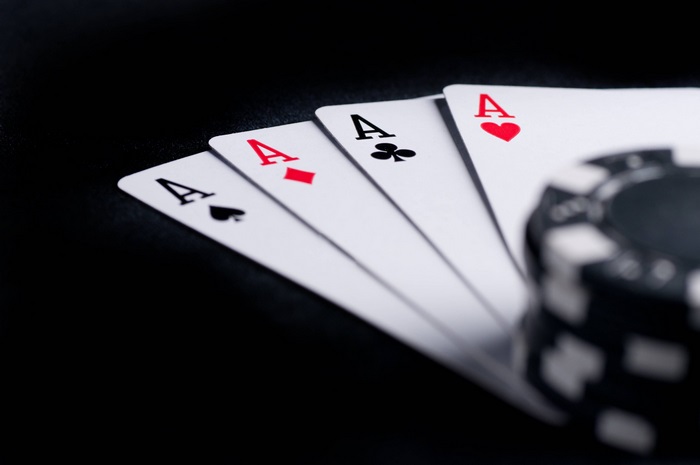 Four Aces and a Poker Chip