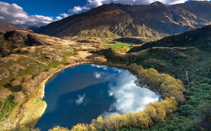 Lake reflecting mountains and sky