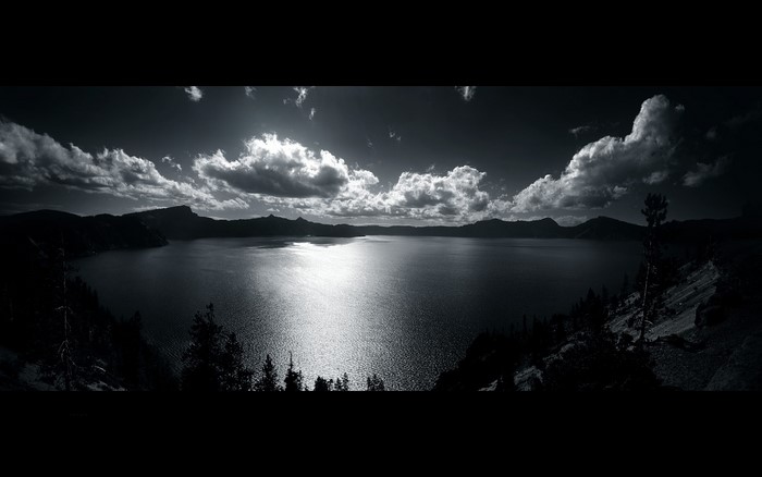 Black and white panoramic lake landscape with clouds