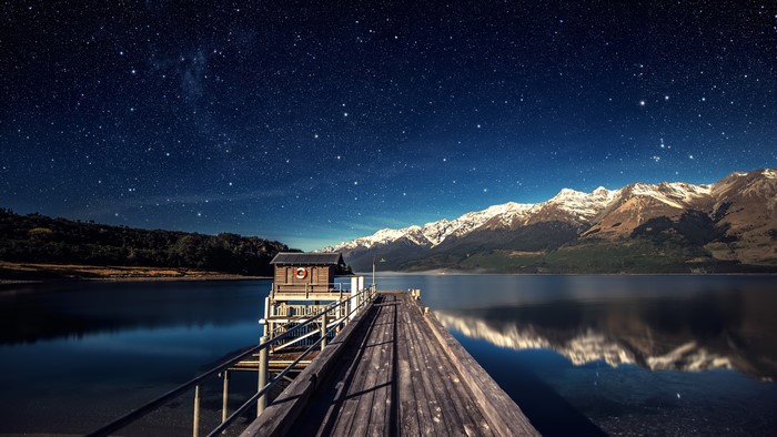 Starry Night Over Lake and Mountain Reflection