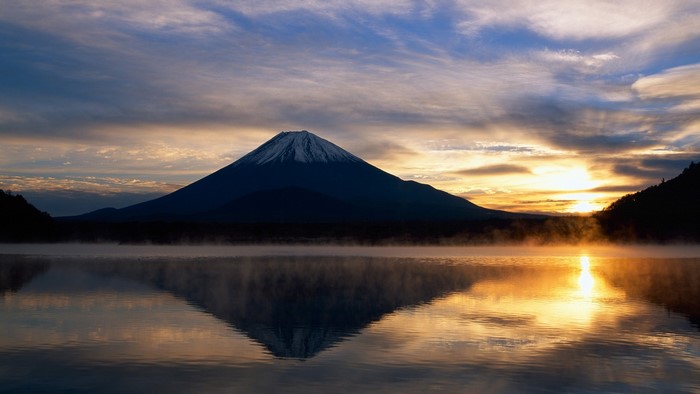 Mount Fuji reflection at sunrise with mist