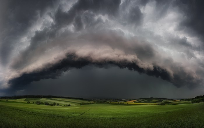 Dramatic Supercell Storm Over Lush Green Field