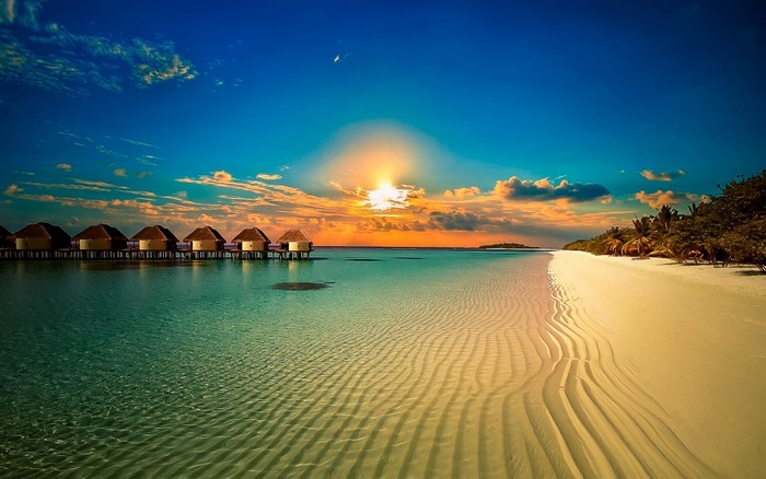 Tropical Beach Sunset with Overwater Bungalows
