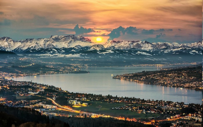 Lake Zurich cityscape with snowy mountains at sunrise