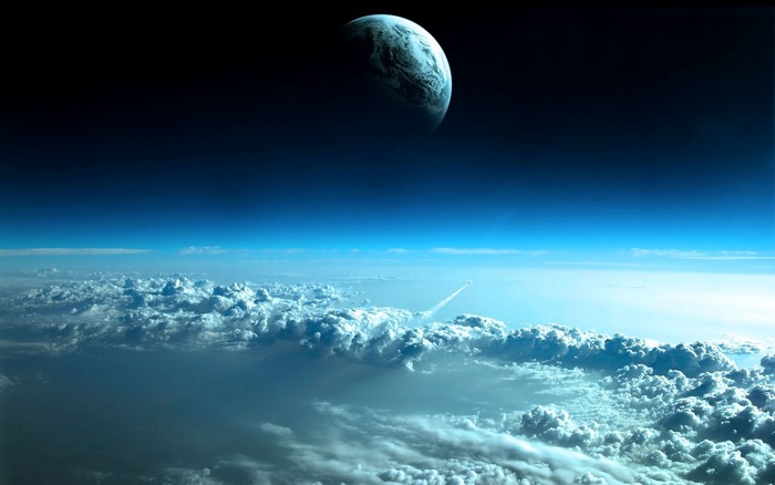Earth and Moon seen from space above clouds