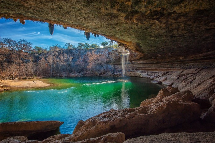 Serene Cave with Waterfall and Lake
