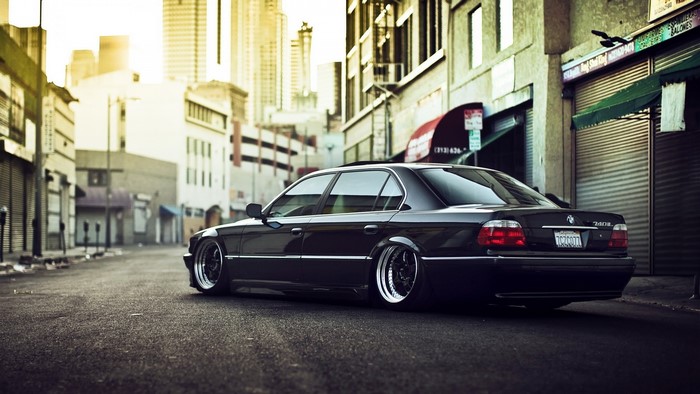 Black BMW 740iL parked on a city street