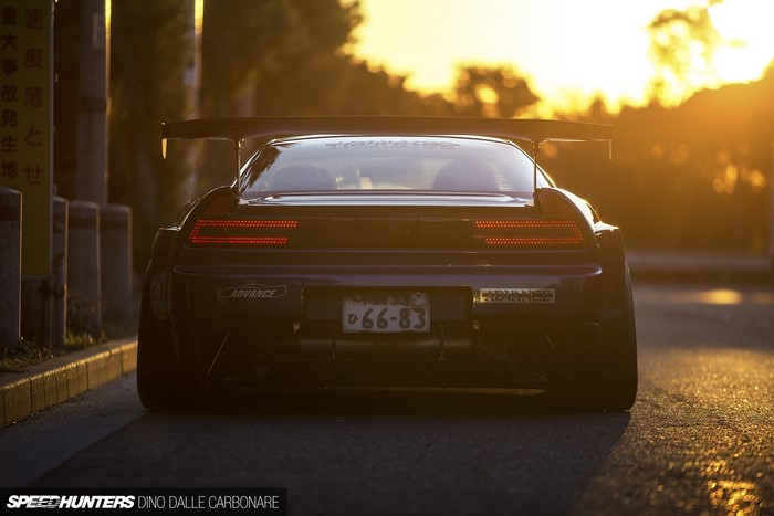 Honda NSX with large rear spoiler at sunset