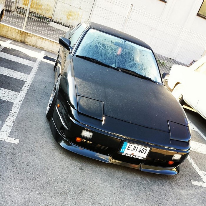 Black Nissan Sports Car in Urban Parking