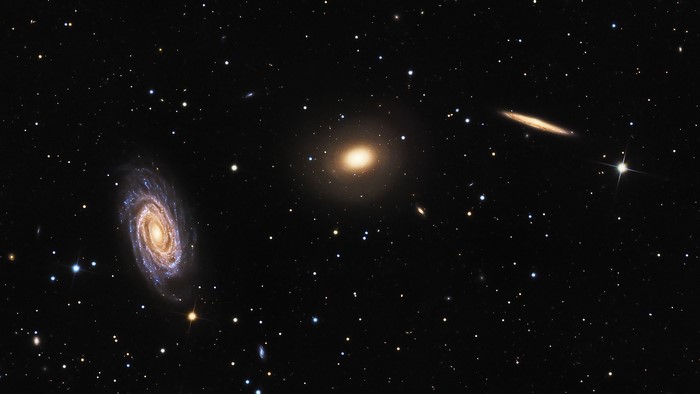 Three Distinct Galaxies Against Starry Universe