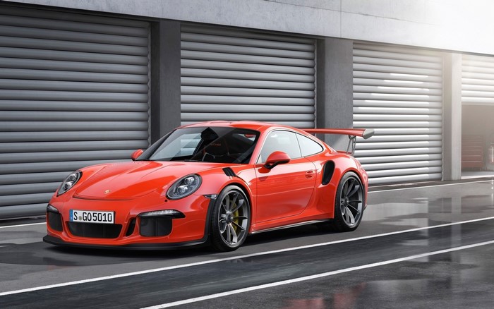 Orange Porsche 911 GT3 RS on a Racetrack