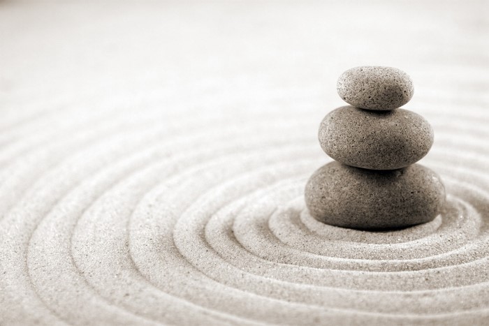Stacked stones on raked sand
