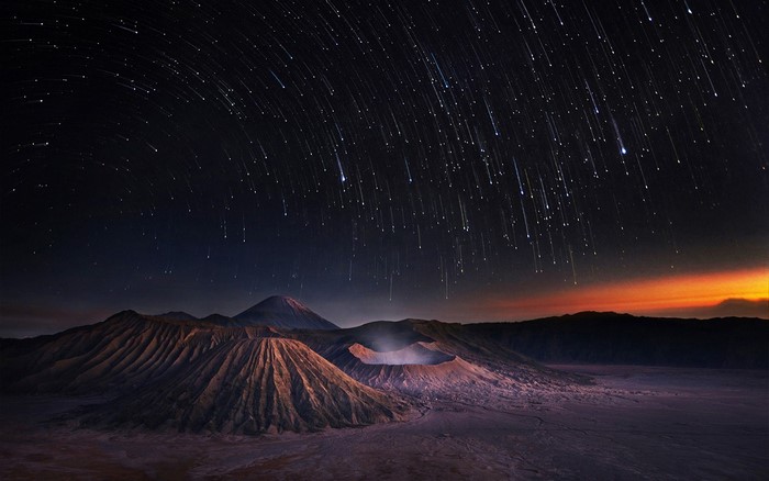 Star trails over Mount Bromo volcano crater, Indonesia