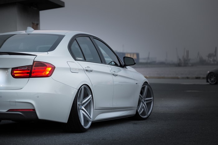 White BMW sedan with Vossen wheels