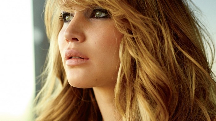 Jennifer Lawrence with blonde hair and green eyes