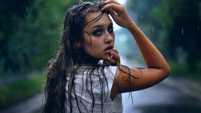 Woman with wet hair in the rain