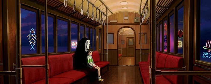 No-Face and Chihiro on a train from Spirited Away