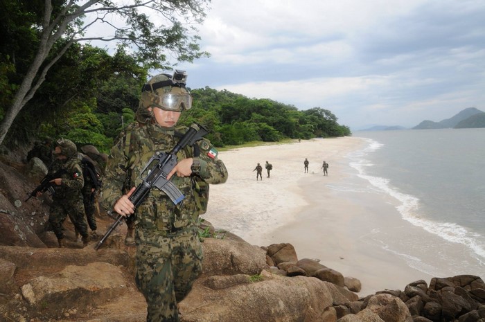 Mexican soldiers on a beach training exercise