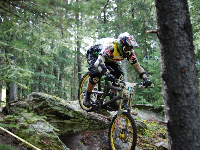 Downhill mountain biker on a rocky trail