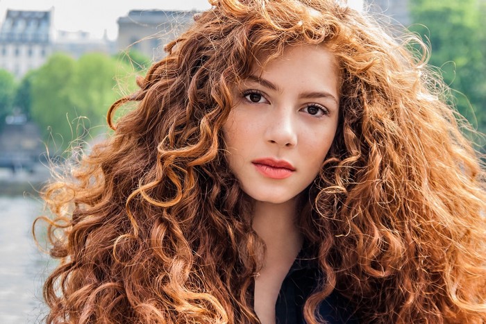 Woman with long curly red hair