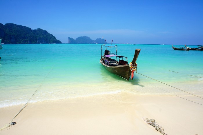 Longtail boat on a tropical beach in Thailand