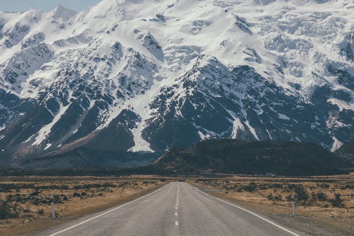 Road leading to snow-capped Aoraki Mount Cook, New Zealand