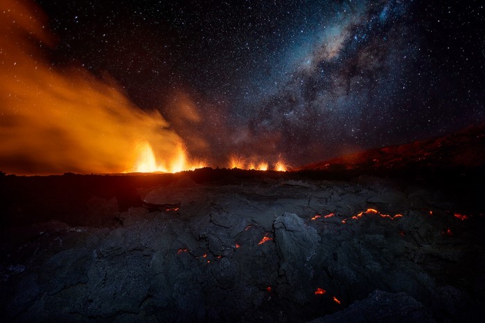 Volcano eruption under the Milky Way