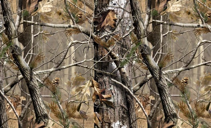 Woodland camouflage pattern with trees and leaves