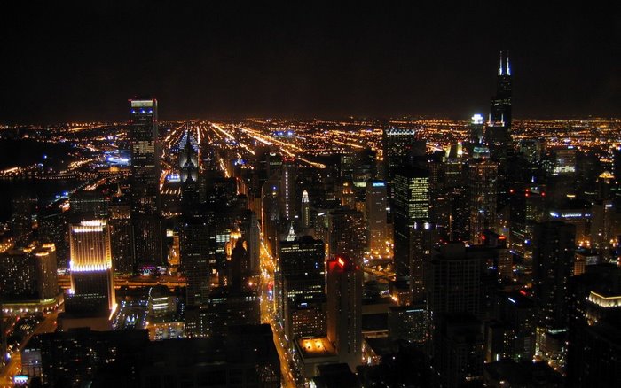 Night cityscape with illuminated skyscrapers and city lights