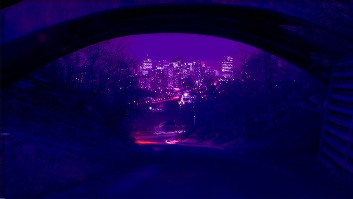 Neon Cityscape at Night Under Bridge