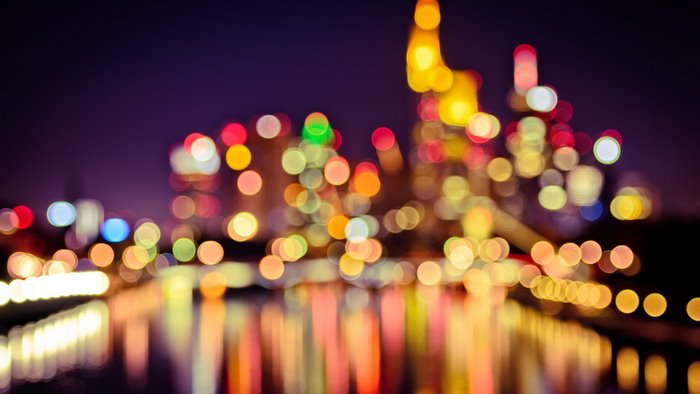 Night lights bokeh cityscape reflection water colorful