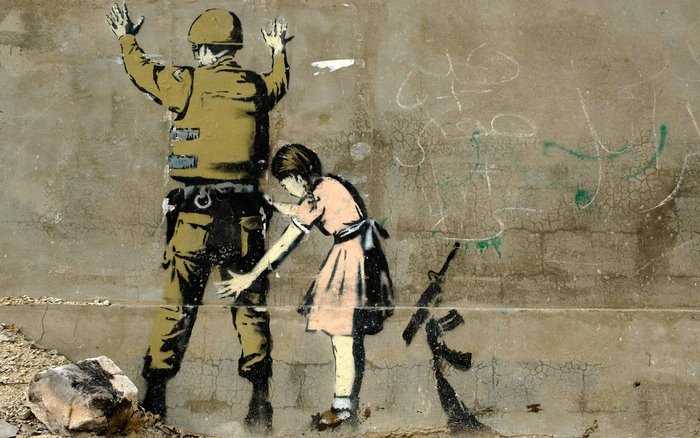 Banksy graffiti of a soldier and a girl