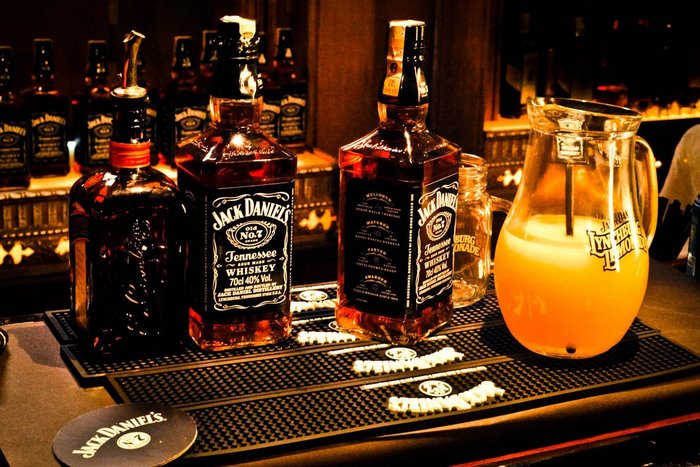 Jack Daniel's Whiskey bottles and pitcher of lemonade