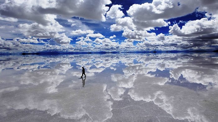 Salar de Uyuni salt flat with clouds reflected