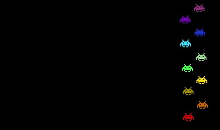 Space Invaders characters in rainbow colors on black background