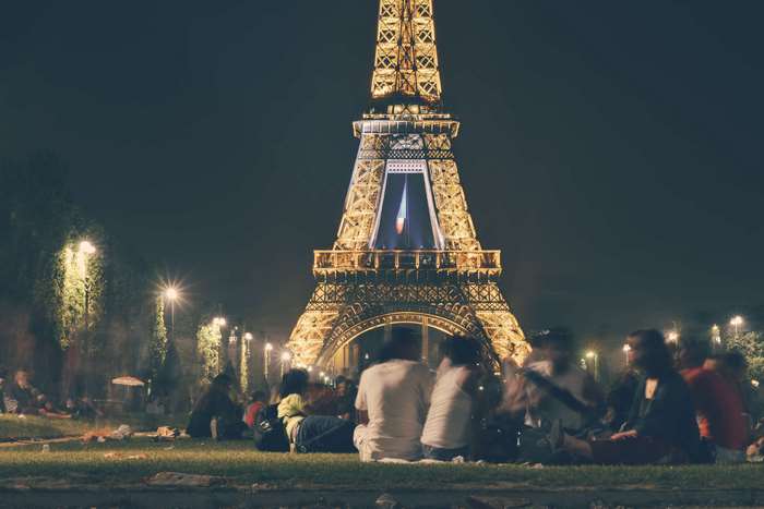 People picnic at Eiffel Tower at night 4K